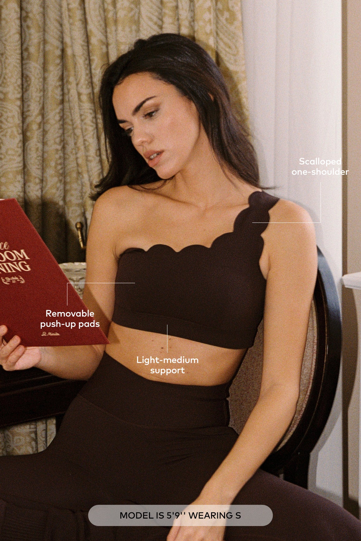 WISKII dynamic one-shoulder sports bra in black, showing its stylish design and comfortable fit for active wear.