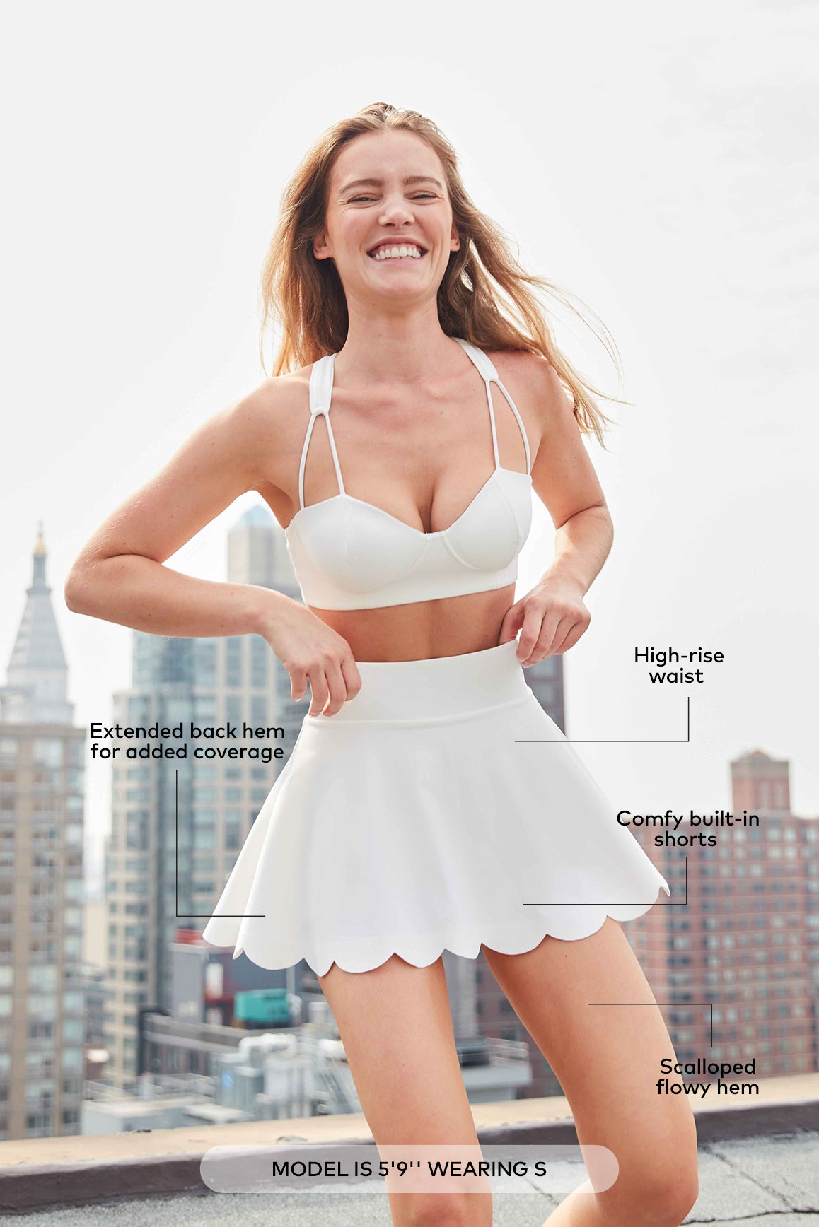 WISKII high-waist A-line tennis skirt with pleated design and athletic fit, shown on a model for activewear and sports fashion.
