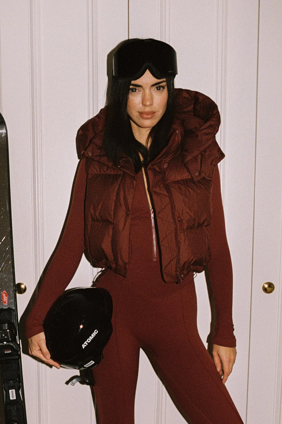 WISKII Cropped Convert Down Jacket showing a stylish black hooded jacket with quilted design and zip closure.
