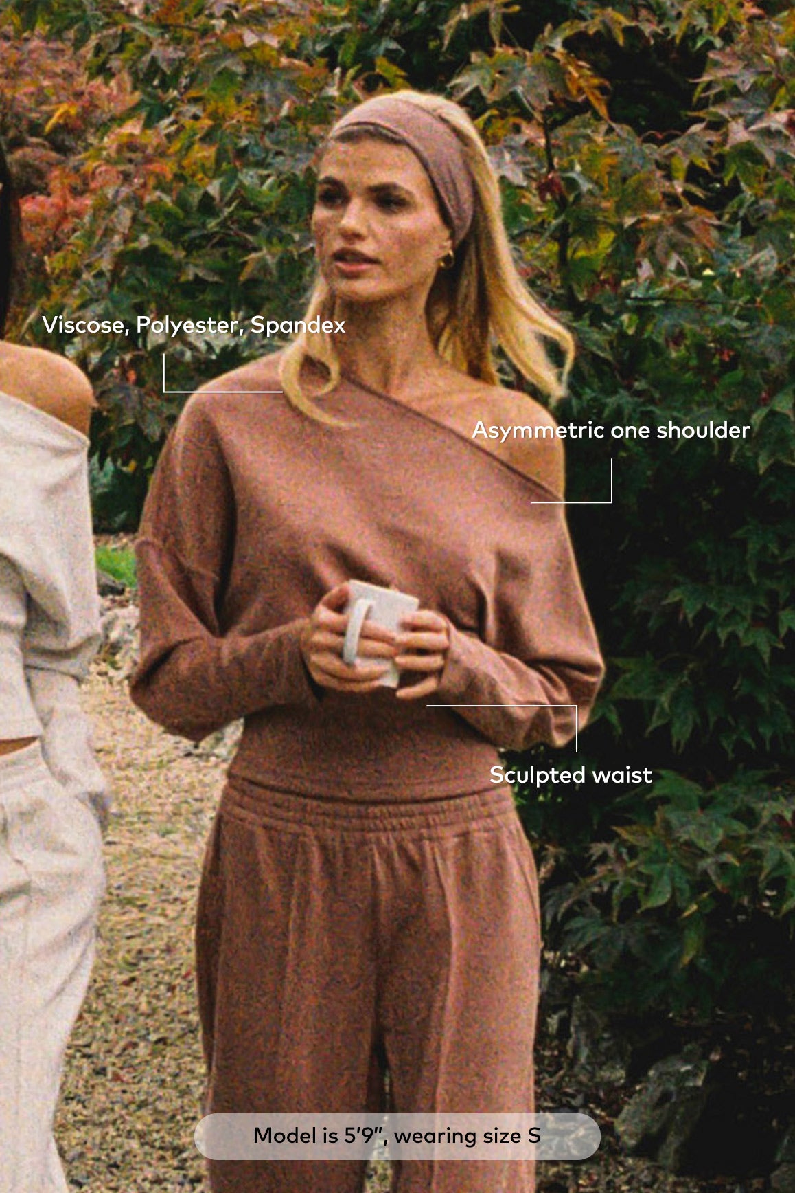 WISKII vivid asymmetric long sleeve top in bright colors with a unique design, shown on a model.