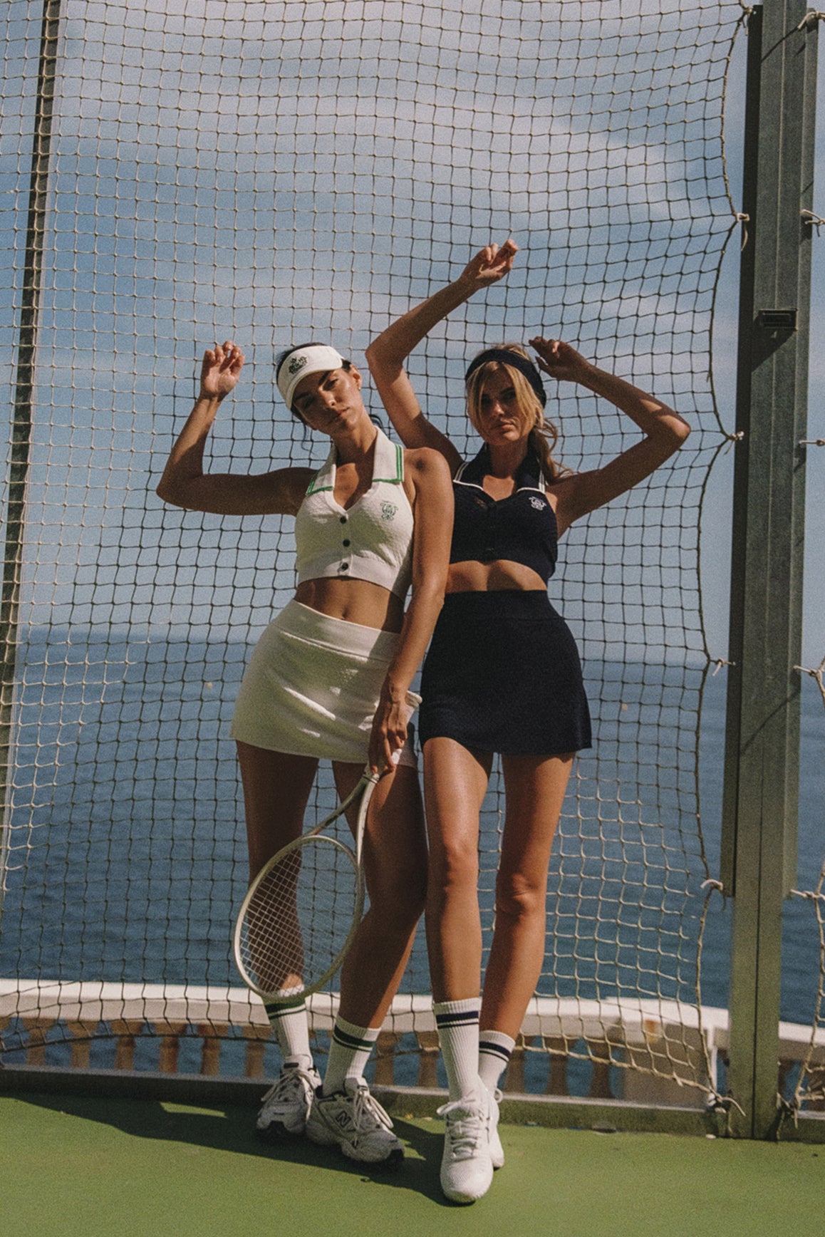 WISKII Riviera Retro Tennis Visor in white with a curved brim and adjustable strap, designed for sporty and stylish outdoor wear.