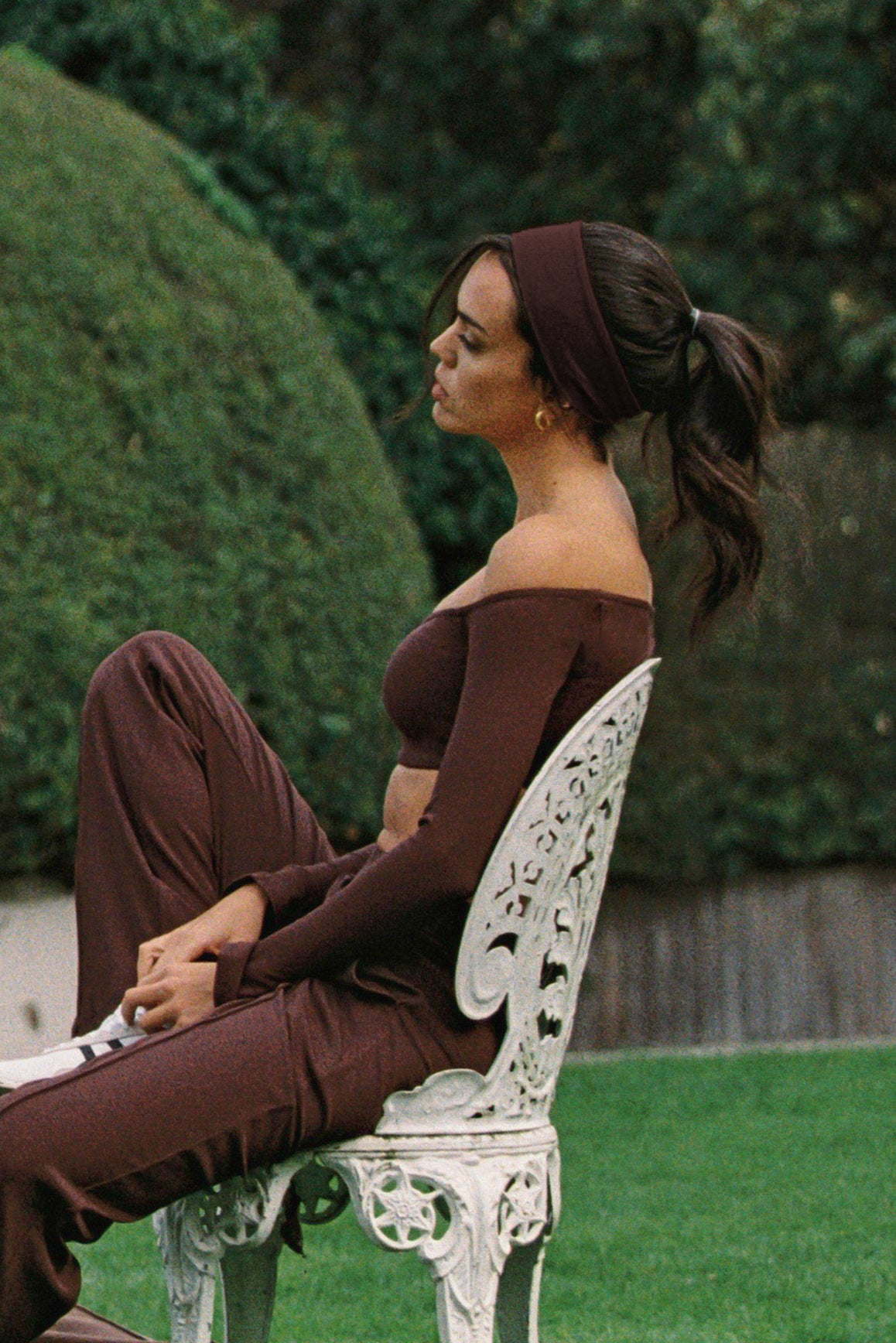 WISKII off-shoulder crop top in a stylish design, showcasing elegant sleeves and a fitted silhouette.