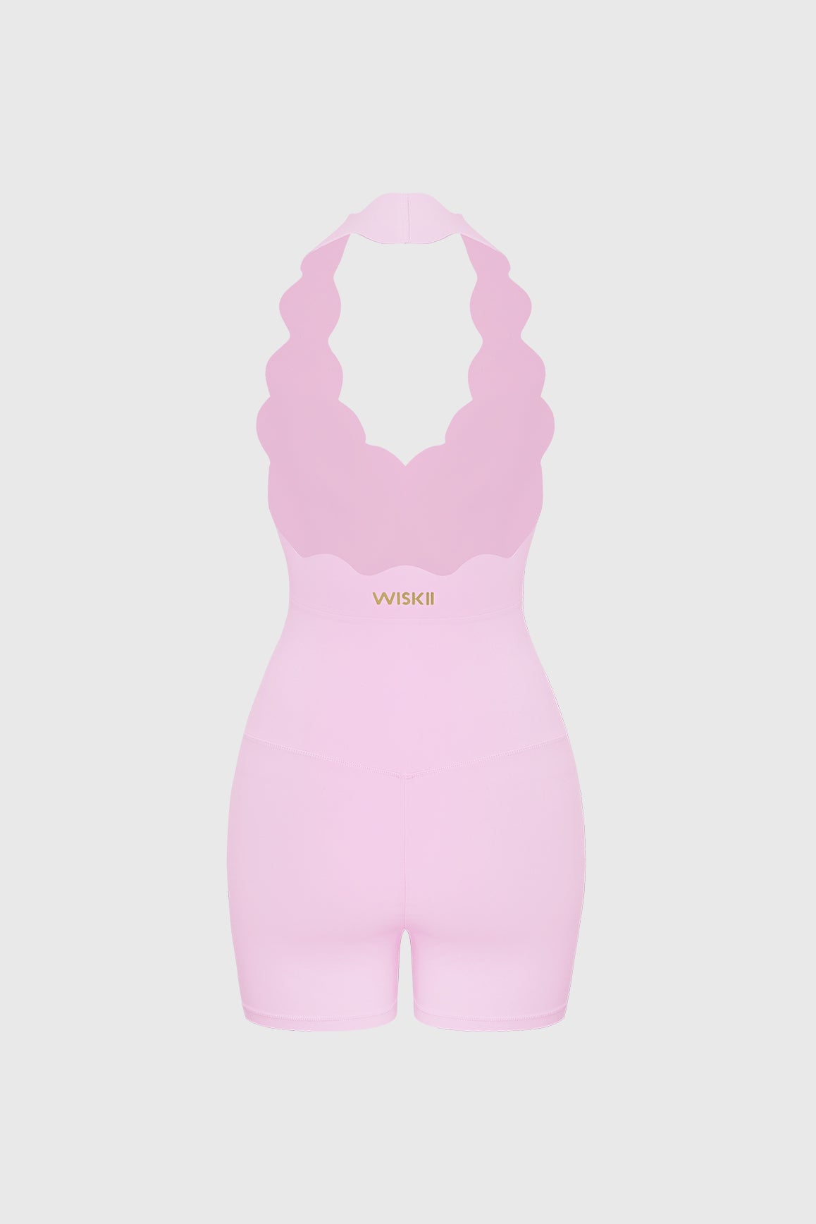 WISKII scallop-halter hourglass playsuit featuring a fitted silhouette and scallop detailing, shown on a model.