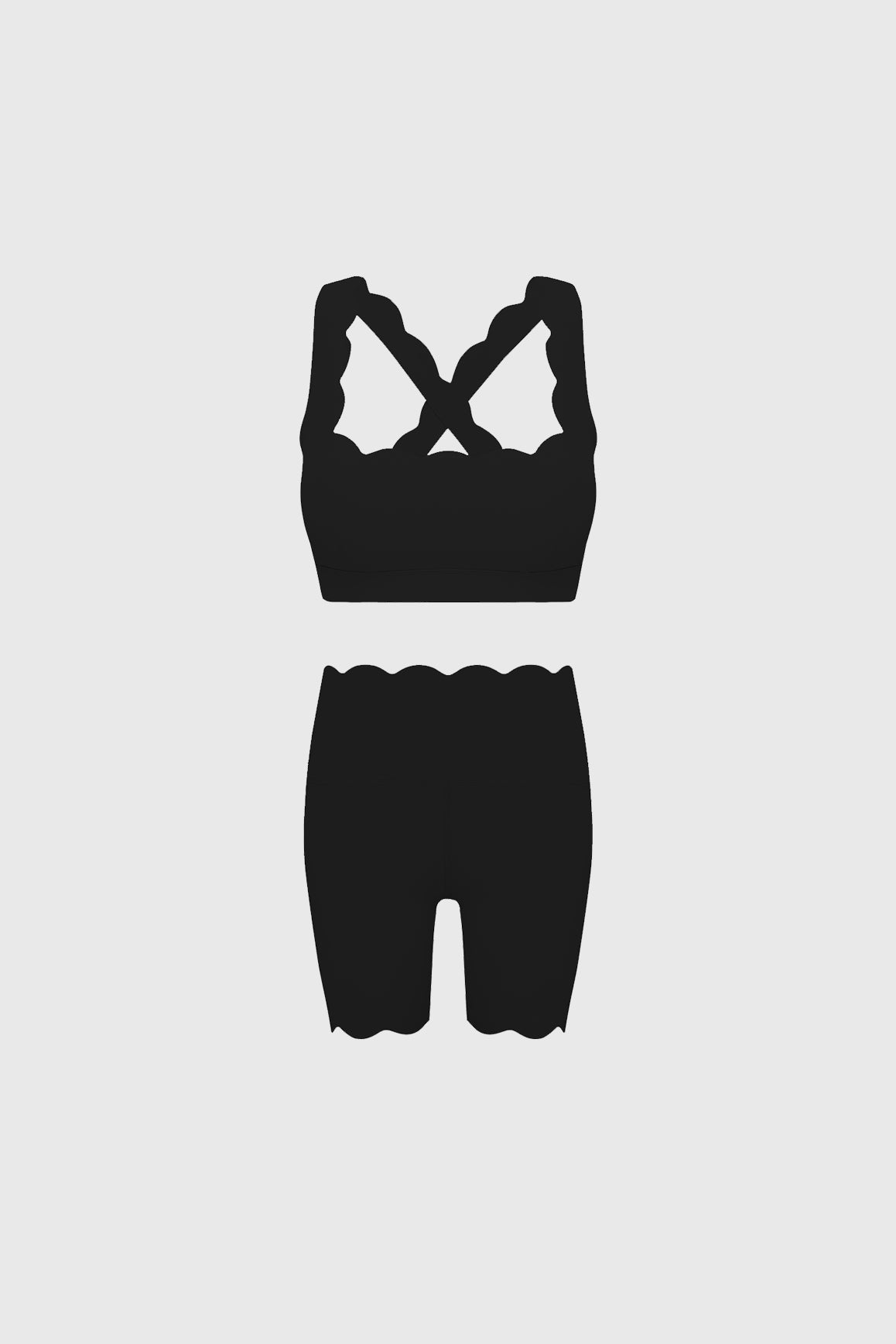 Black WISKII sports bra with cross back and matching high-waist biker shorts, ideal for active wear and workout outfits.