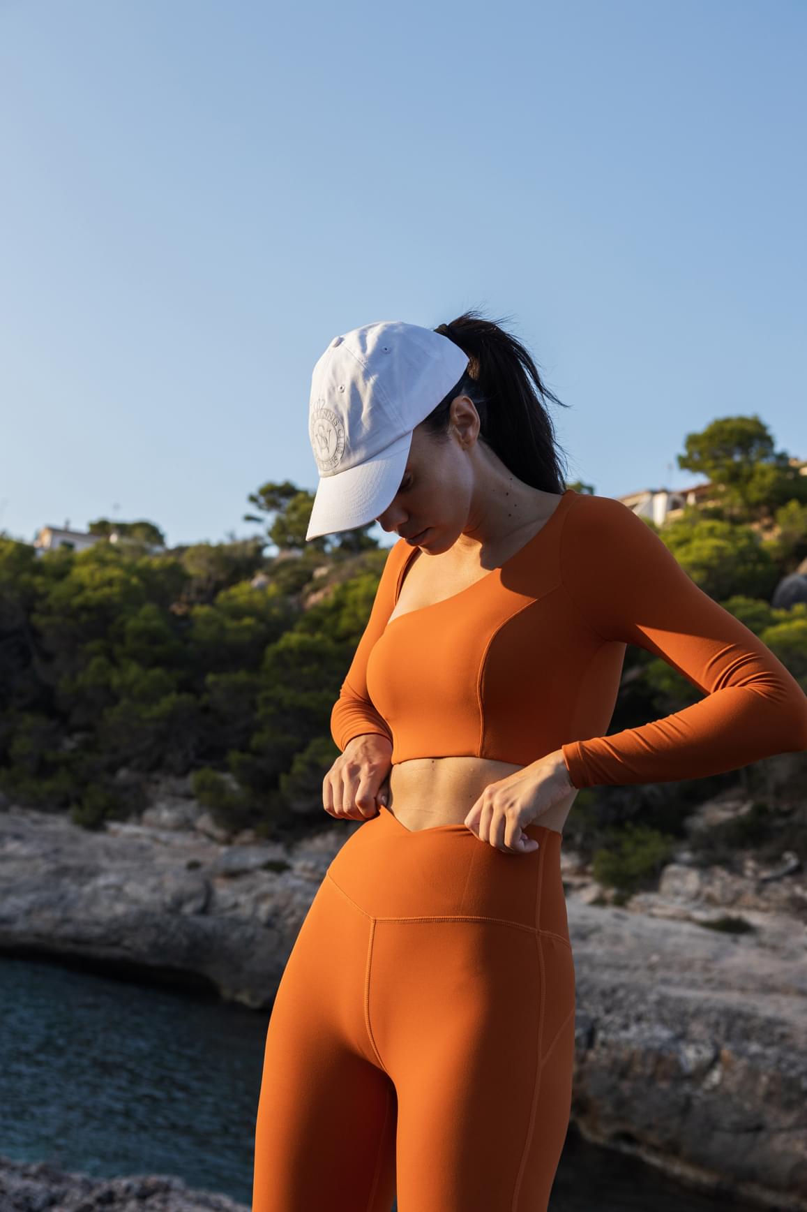 Ivory WISKII long sleeve crop top with unique cut-out design, stylish and fitted for a modern look.