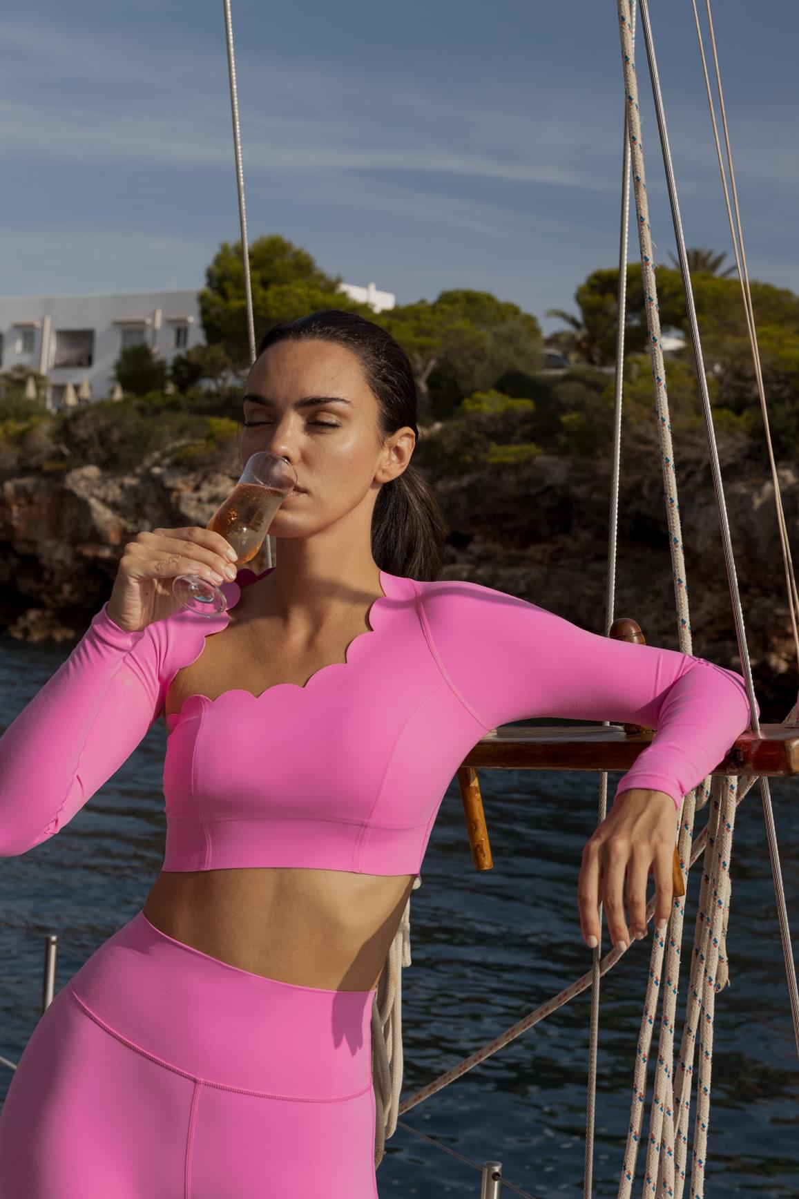 WISKII asymmetrical long sleeve crop top in sakura zen design, featuring a stylish cut and vibrant floral pattern.