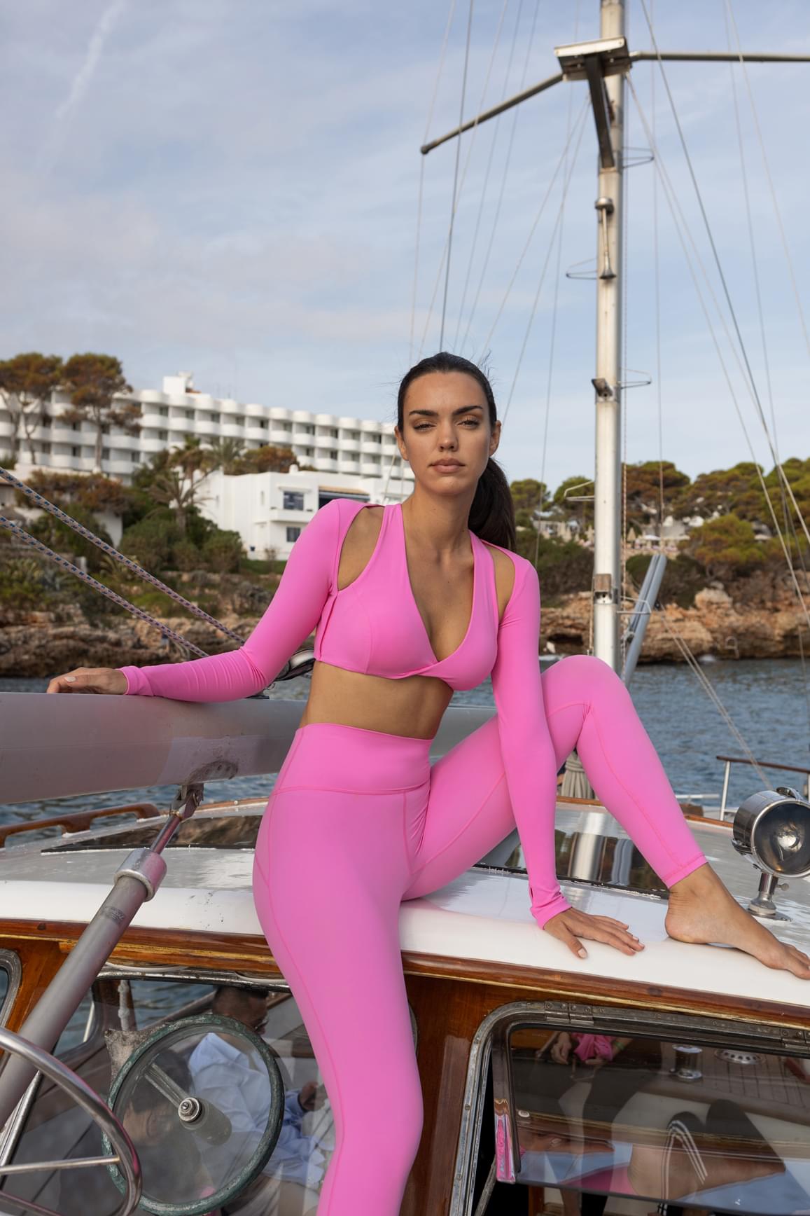 WISKII Sakura Zen Twist-Front Shoulder Cut Crop Top, stylish crop top with twist front design and shoulder cutouts.