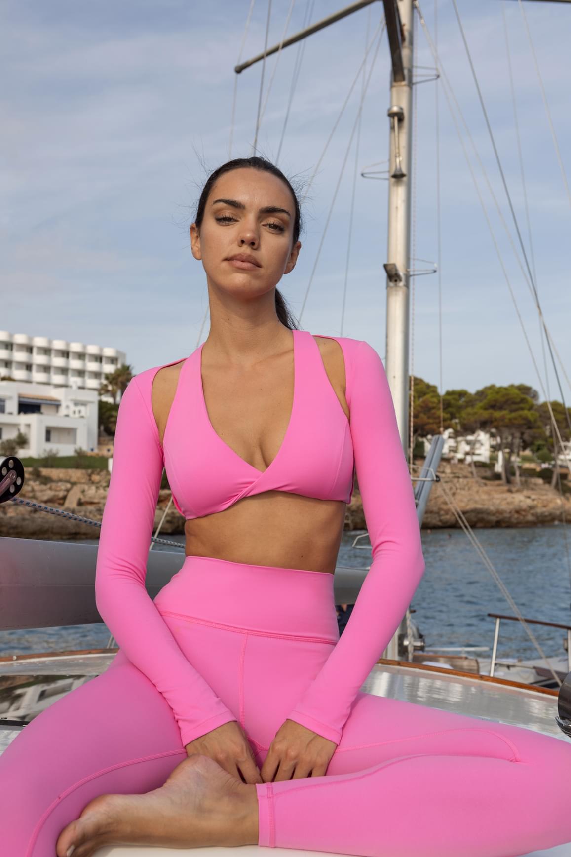 WISKII Sakura Zen twist-front shoulder cut crop top, stylish crop top with twisted front and shoulder cut-out design.