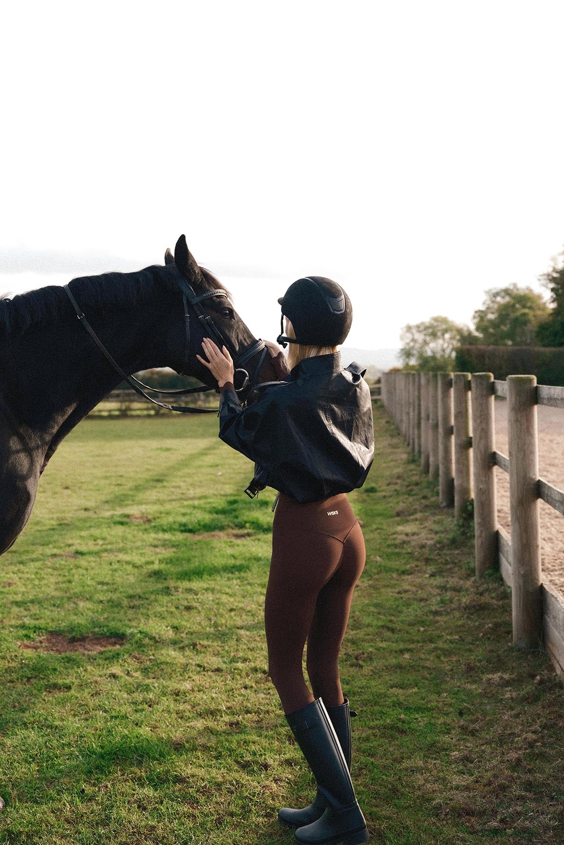 WISKII retro faux leather jacket with hood, featuring a stylish design and textured finish, displayed on a model.