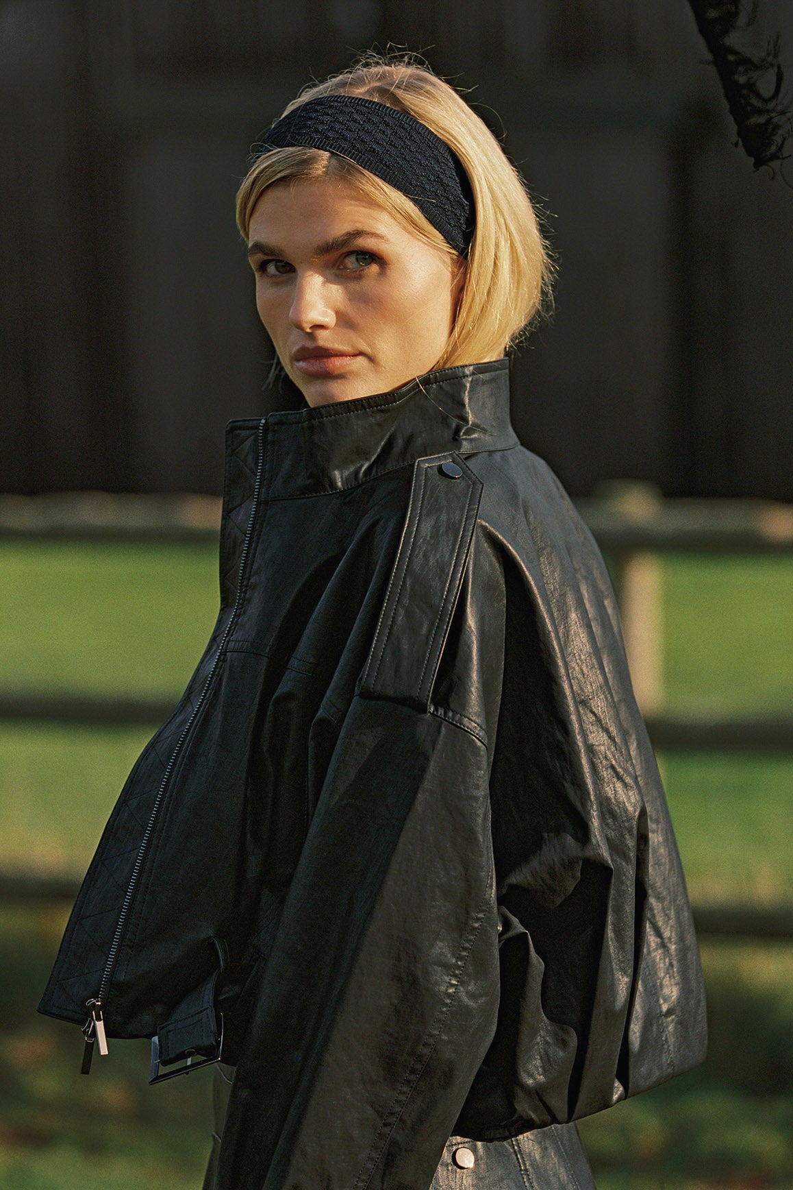 Retro faux leather jacket by WISKII, featuring a stylish hood and a classic design in a rich, textured finish.