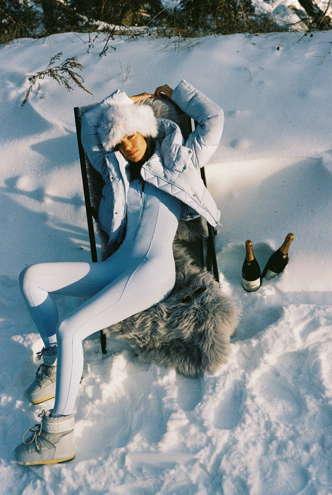 Ivory WISKII long sleeve half-zip full length unitard on a mannequin, showcasing its sleek design and fit.