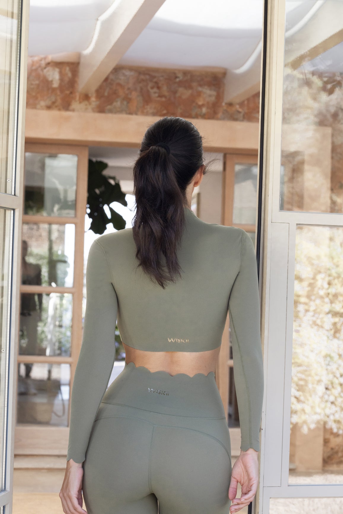 Ivory 7/8 high-waist energy leggings by WISKII, showcasing a snug fit and stretchy fabric for activewear comfort.