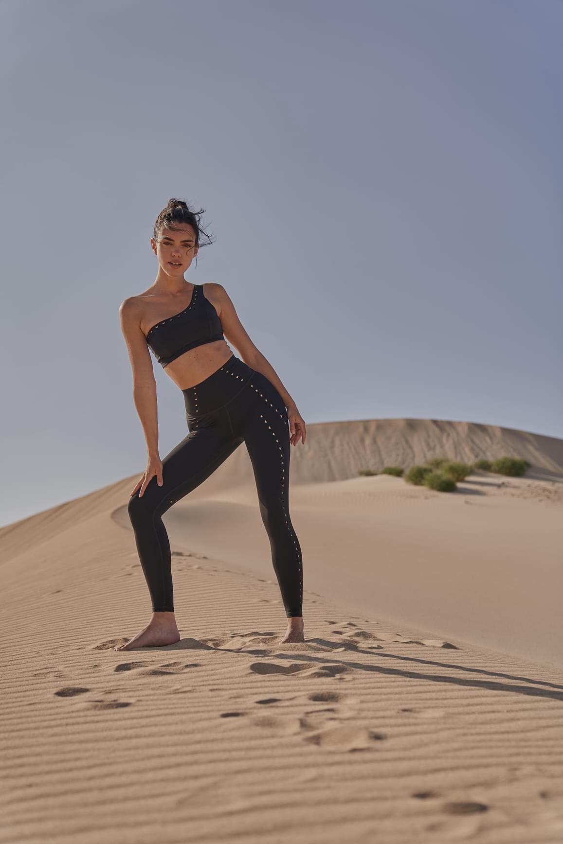 Ivory laser cut training leggings by WISKII, featuring intricate cut-out details and a snug, flexible fit for active wear.