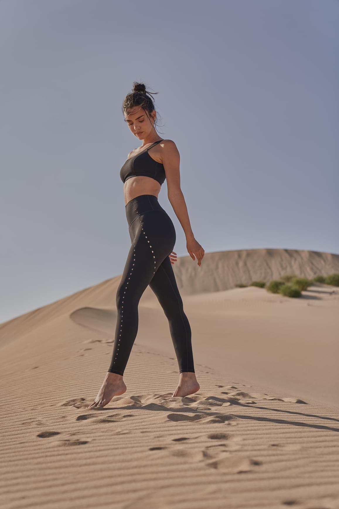 Ivory laser cut leggings by WISKII featuring stylish laser cut details and a comfortable fit for active wear.