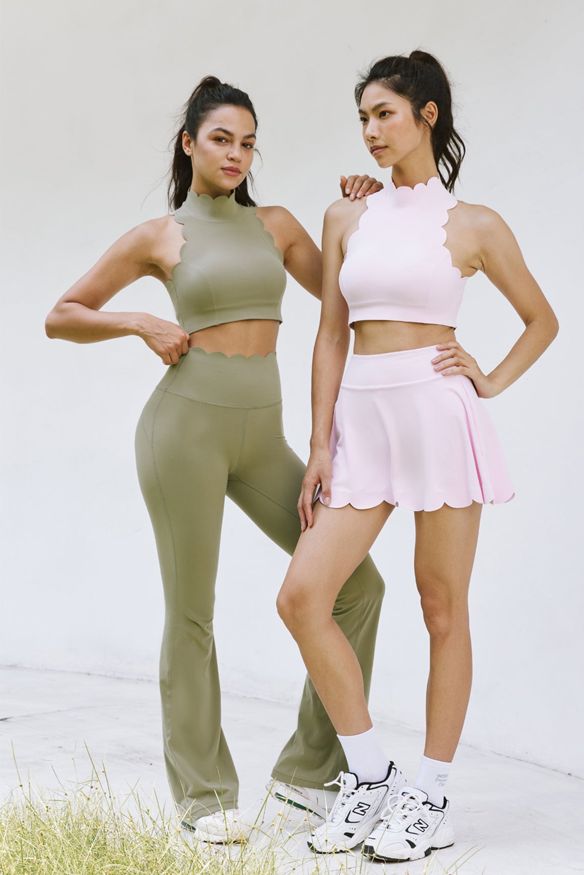 Muted khaki high-waist flare leggings by WISKII, showing a close-up of the fitted waistband and flared leg design.