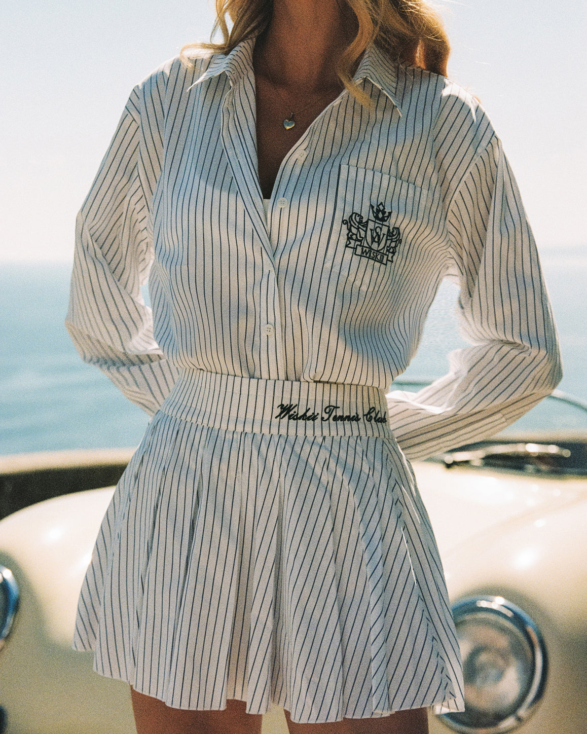 WISKII Riviera pleated skirt in a flowing design, showcasing elegant folds and a stylish silhouette.