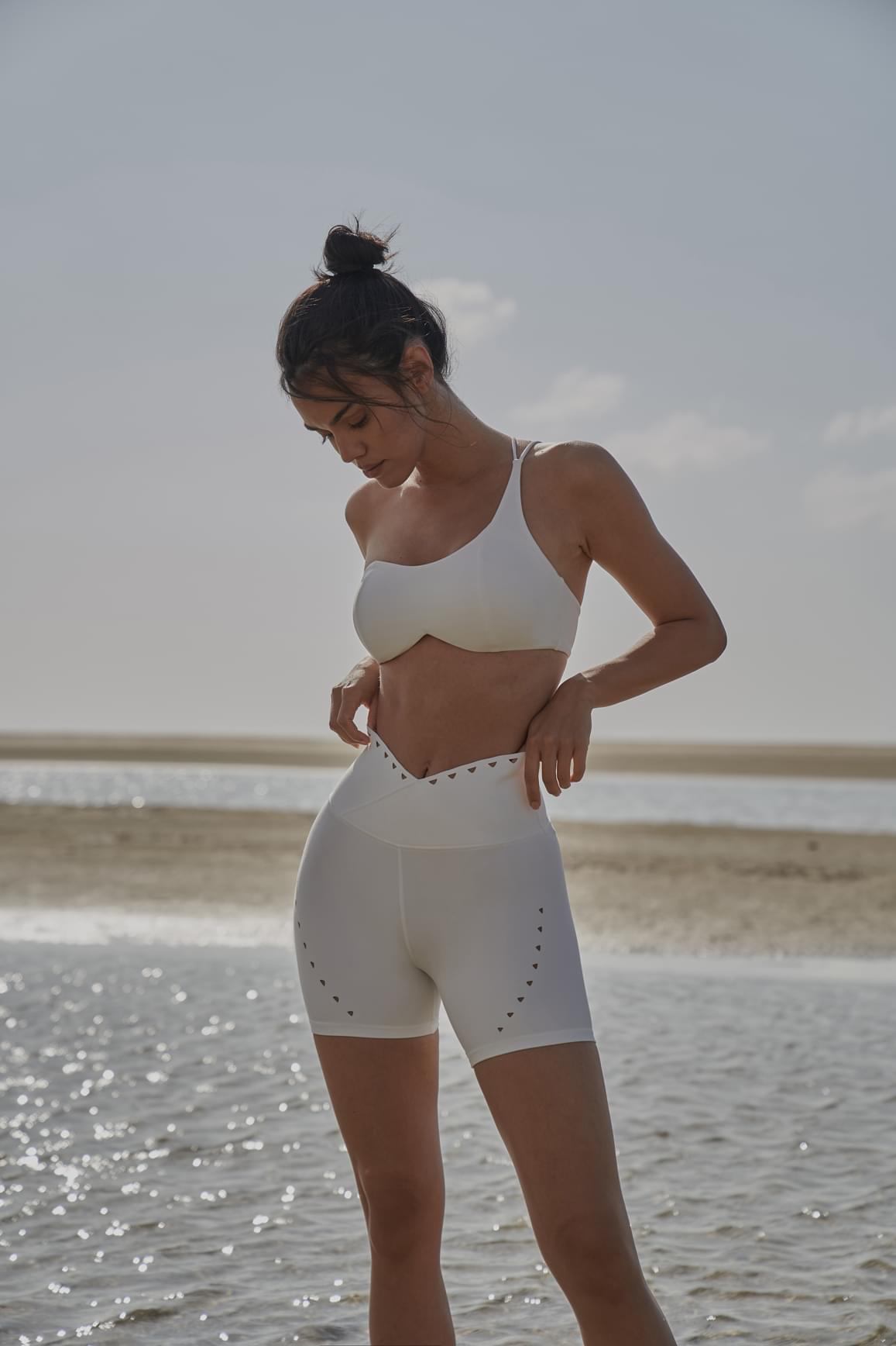 Pink WISKII V-waist laser cut sports shorts with stylish cut-out details, designed for active wear and athletic comfort.