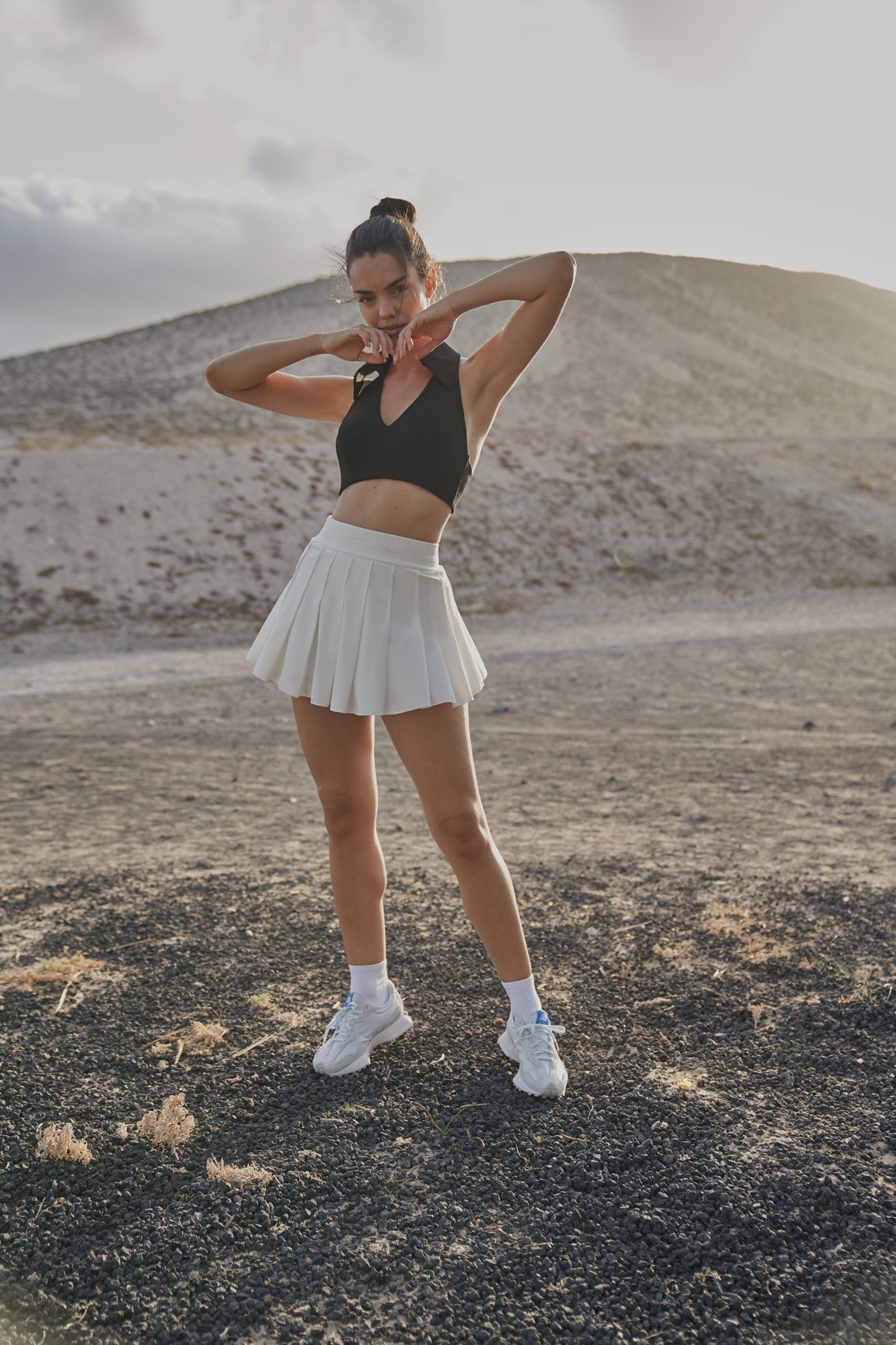 Model wears WISKII A-line Pleated Skirt