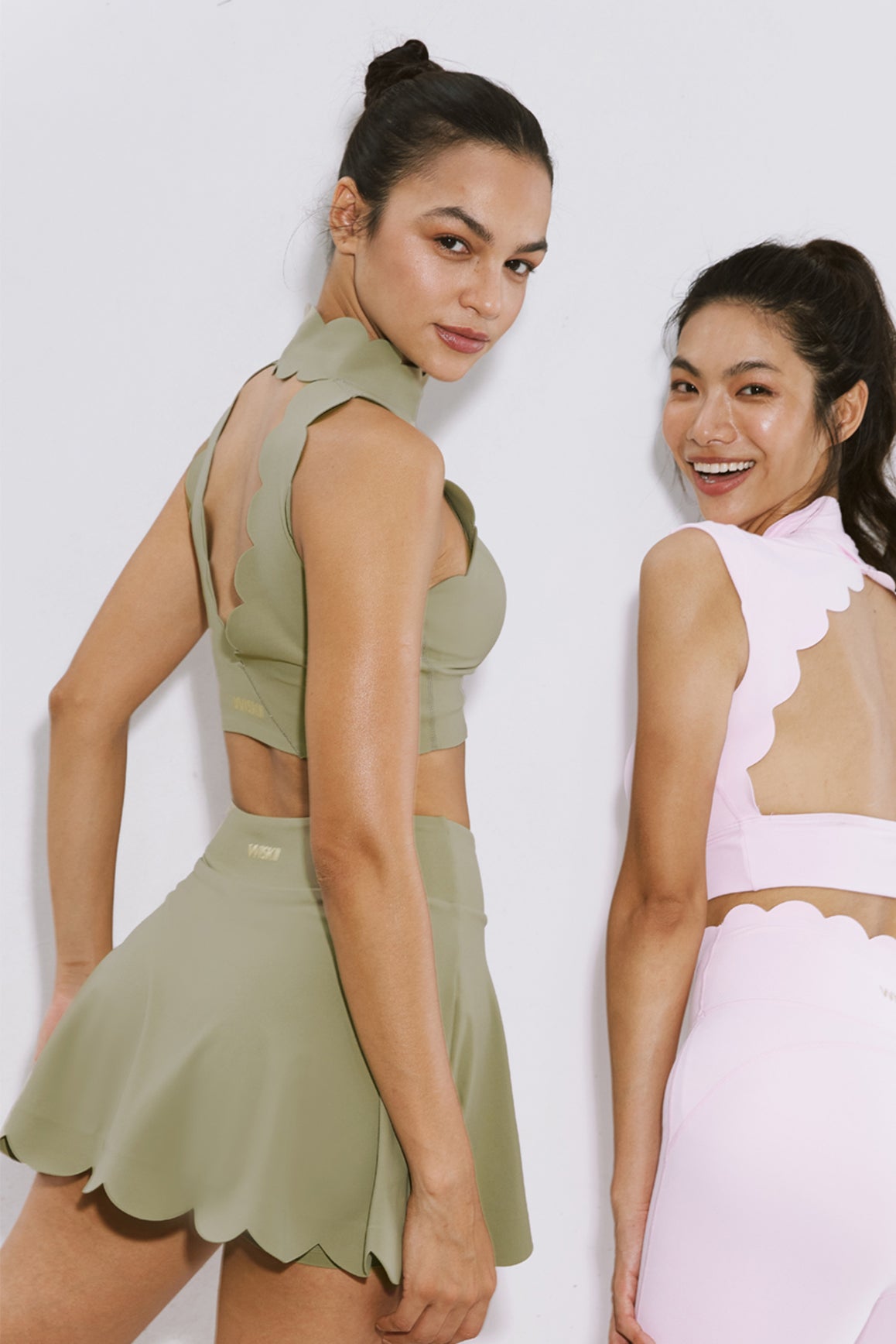 WISKII high-waist A-line tennis skirt in muted khaki fabric, designed for active wear and sporty style.