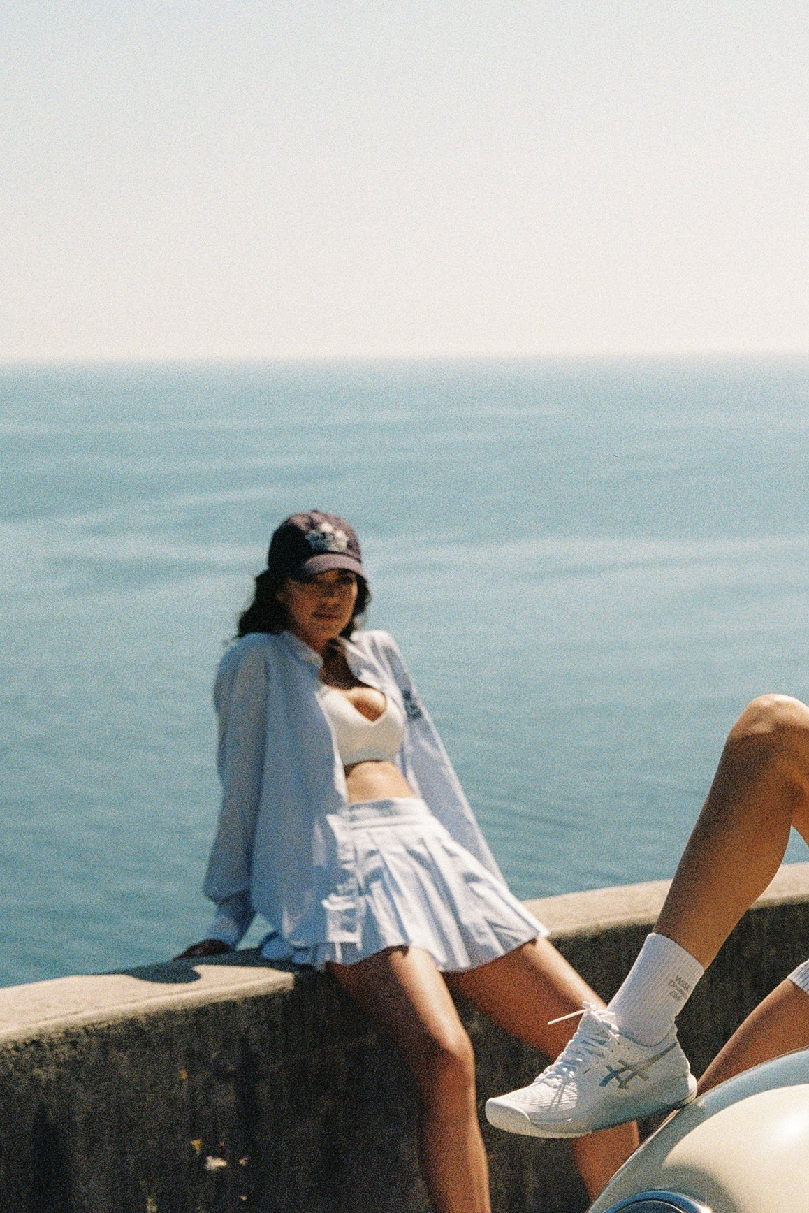 WISKII Riviera Pleated Skirt in light fabric with a flowy, pleated design perfect for summer wear.
