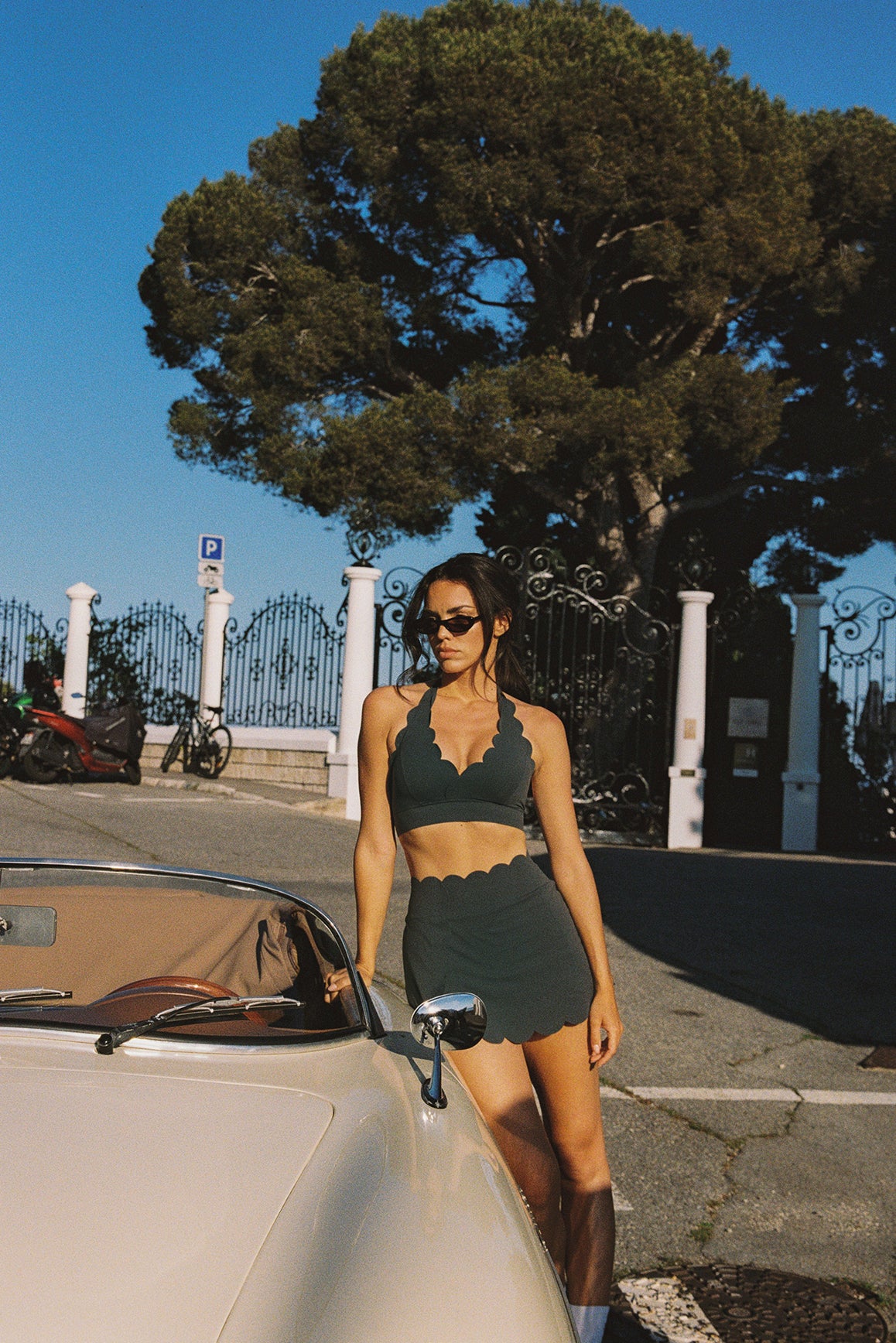 WISKII V-Cut Scallop Halter Bra in black, showcasing a stylish design with scalloped edges and a halter neck style.