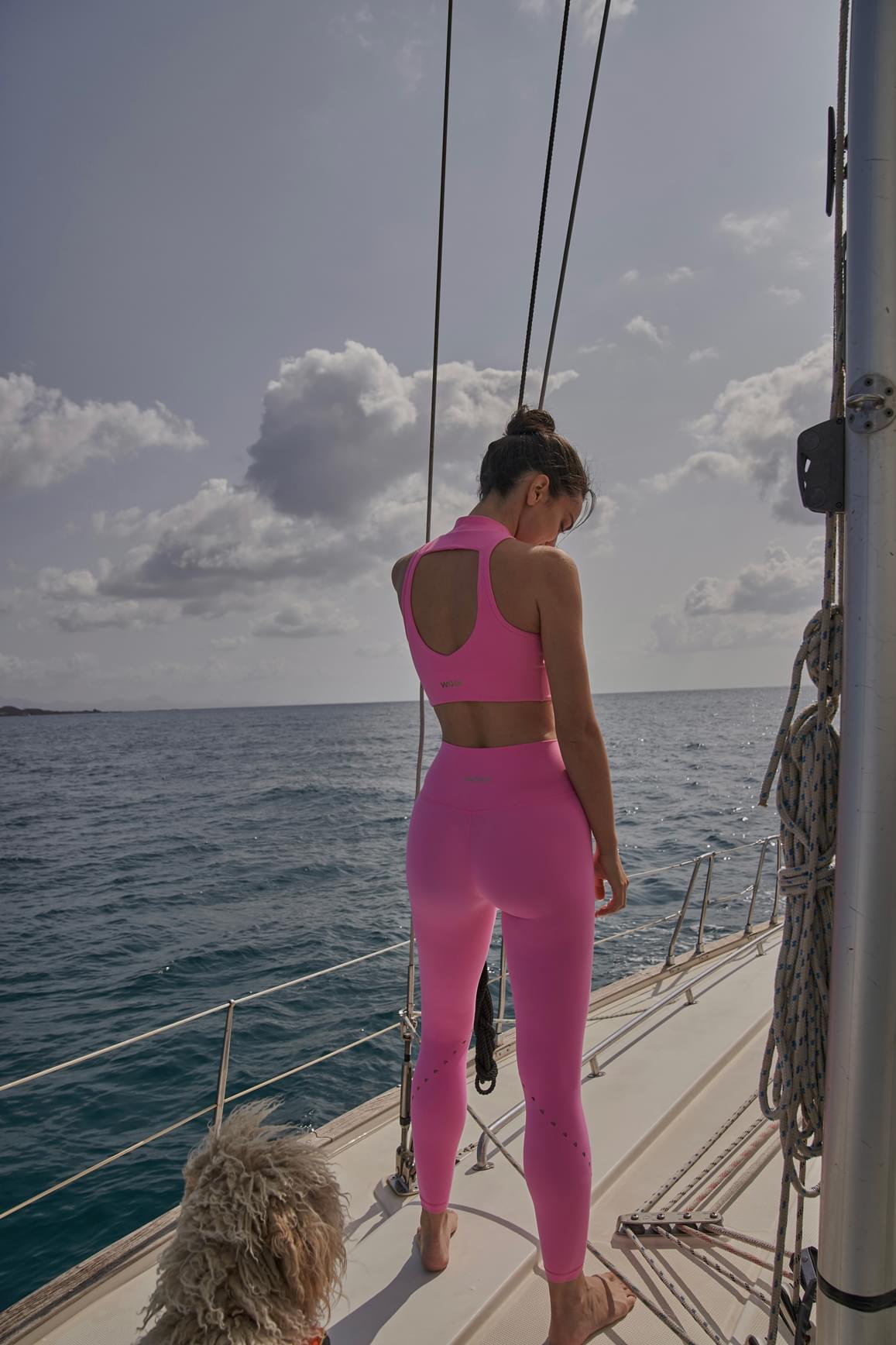 Ivory WISKII sports bra with diamond cutout design and mock neck, showcasing a stylish, supportive sportswear silhouette.