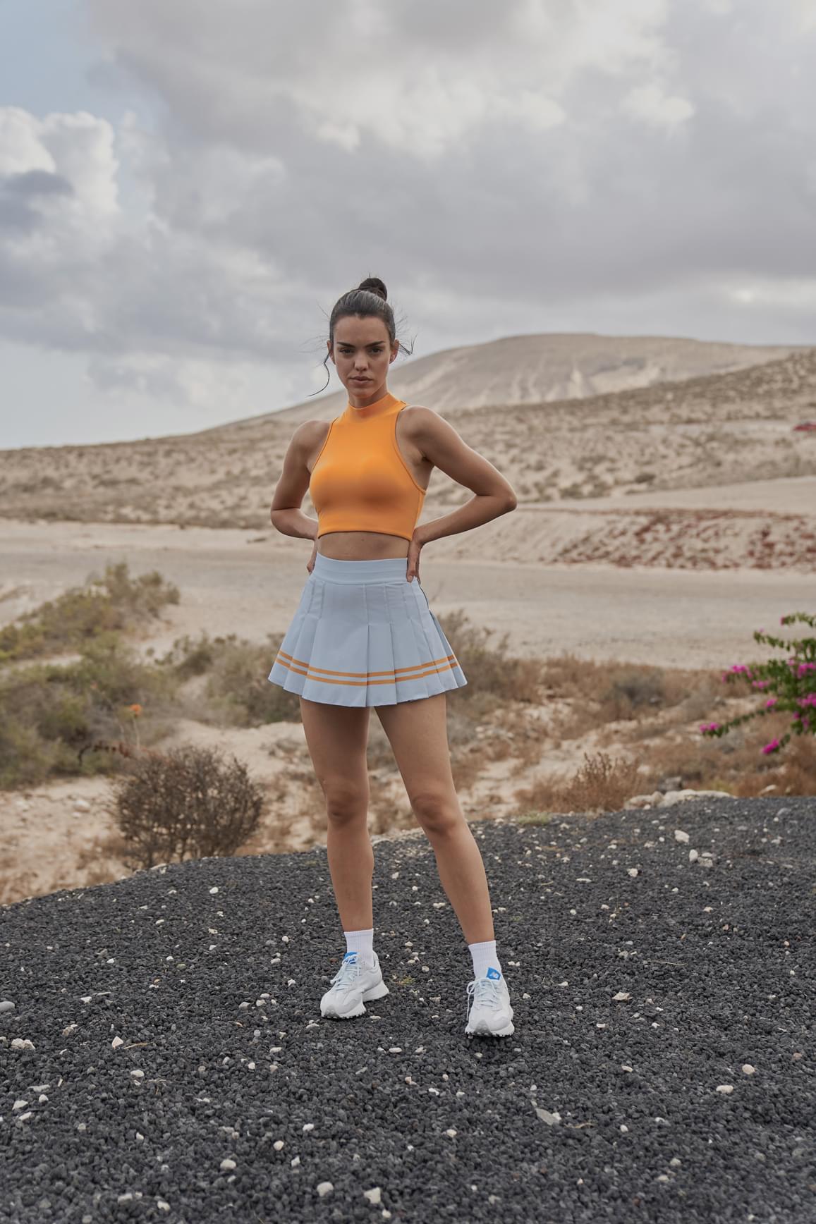 Ivory WISKII sports bra with diamond cutout mock neck design, featuring a sleek, supportive fit for active wear.