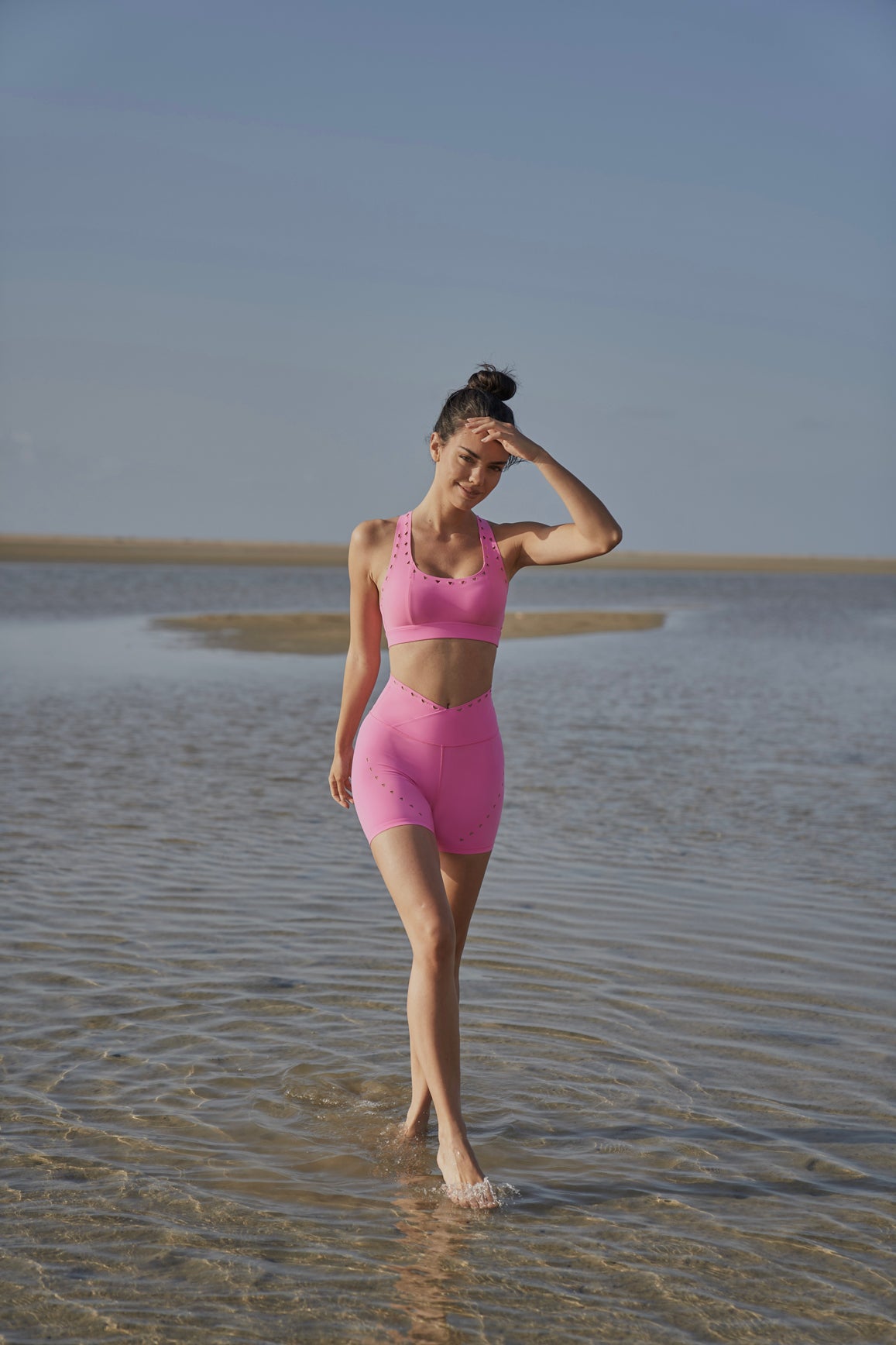 Model wears WISKII Racerback Laser Cut Sports Bra