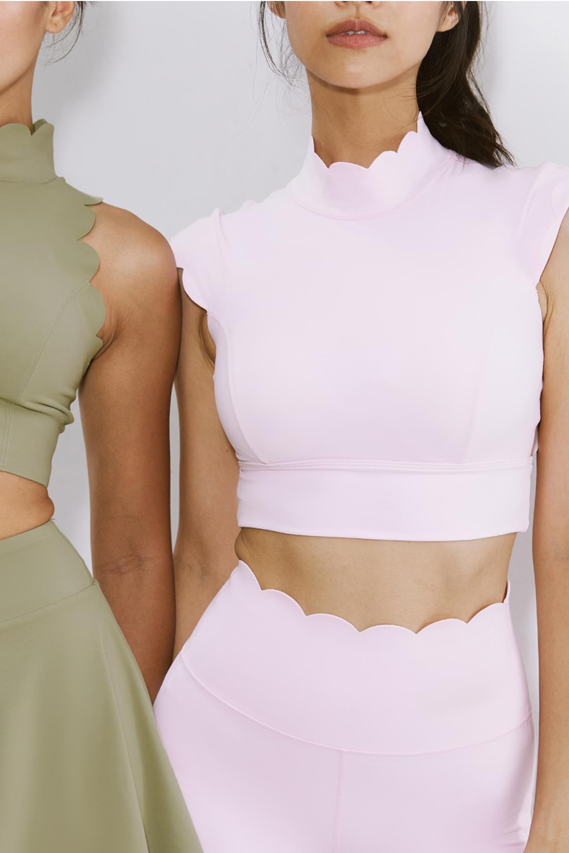 WISKII ivory scallop cutout mock neck sports bra with stylish design and comfortable fit, shown on a white background.