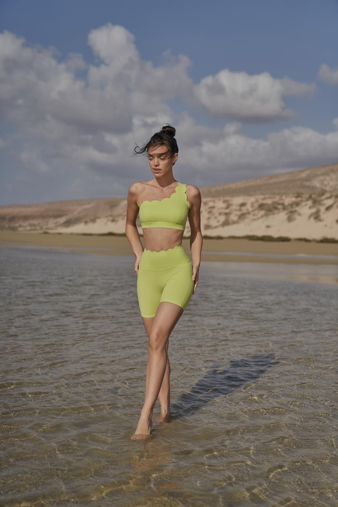 WISKII Dynamic One Shoulder Sports Bra in mulled wine color, featuring sleek design and supportive fit for active wear.