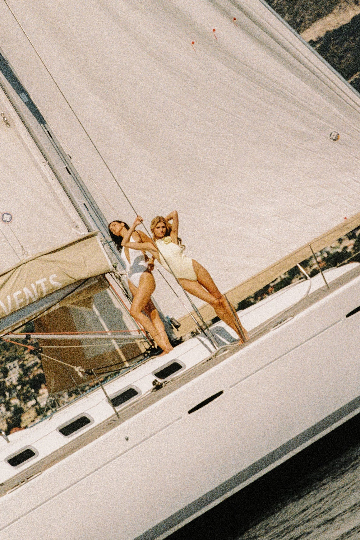 Model wears a Riviera Floral Backless One-piece Swimsuit | Lemon drop Swimsuit | WISKII Active