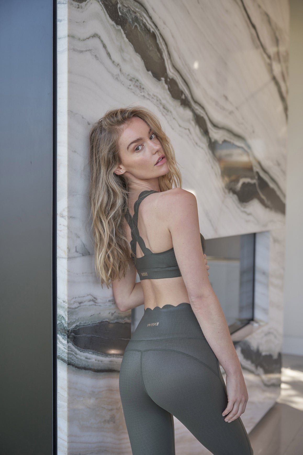 model wears WISKII 7/8 Faux Leather High-Waist Legging