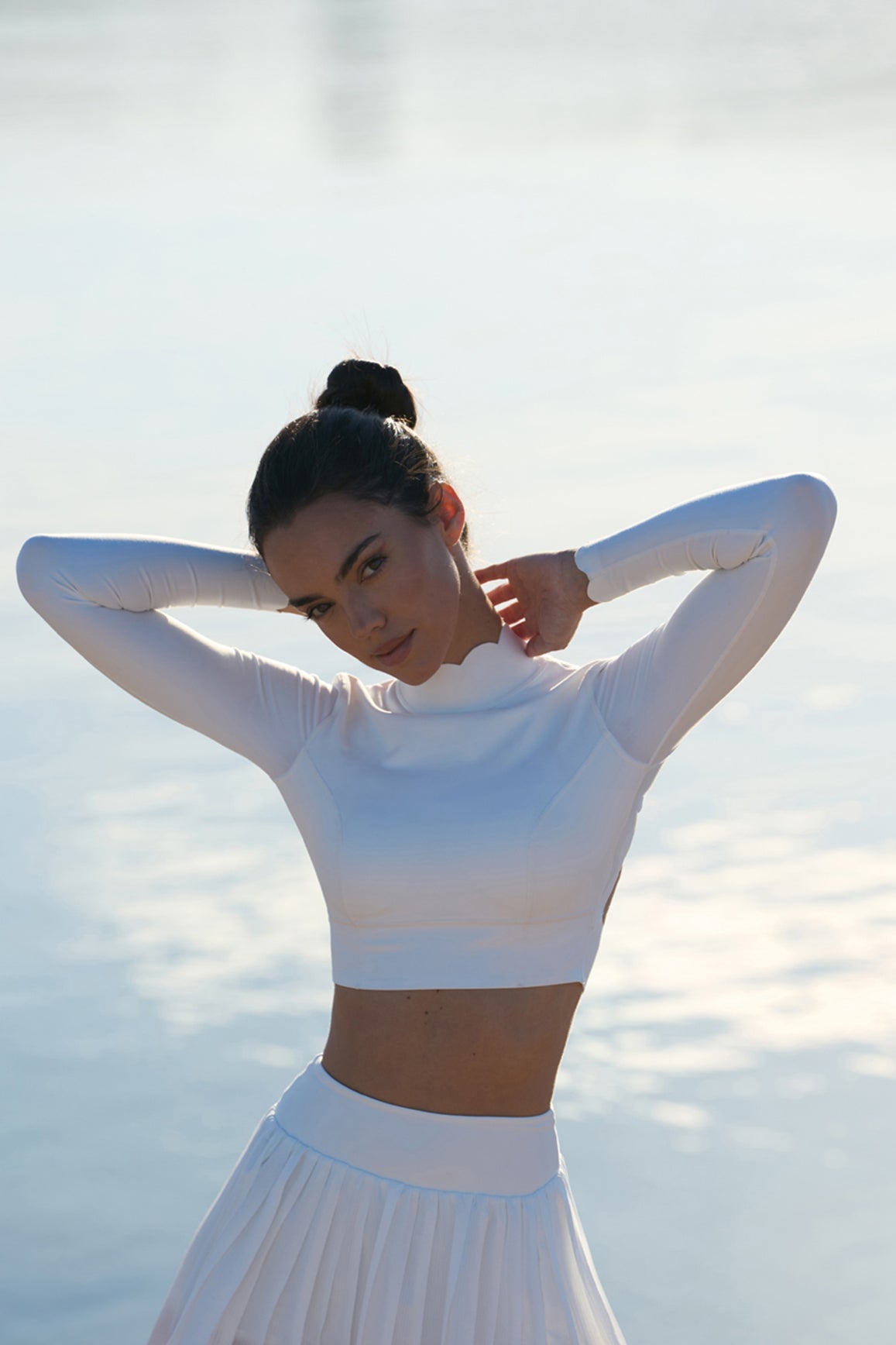 Ivory open back long sleeve crop top from WISKII, stylish crop top with a fitted design and open back detail.