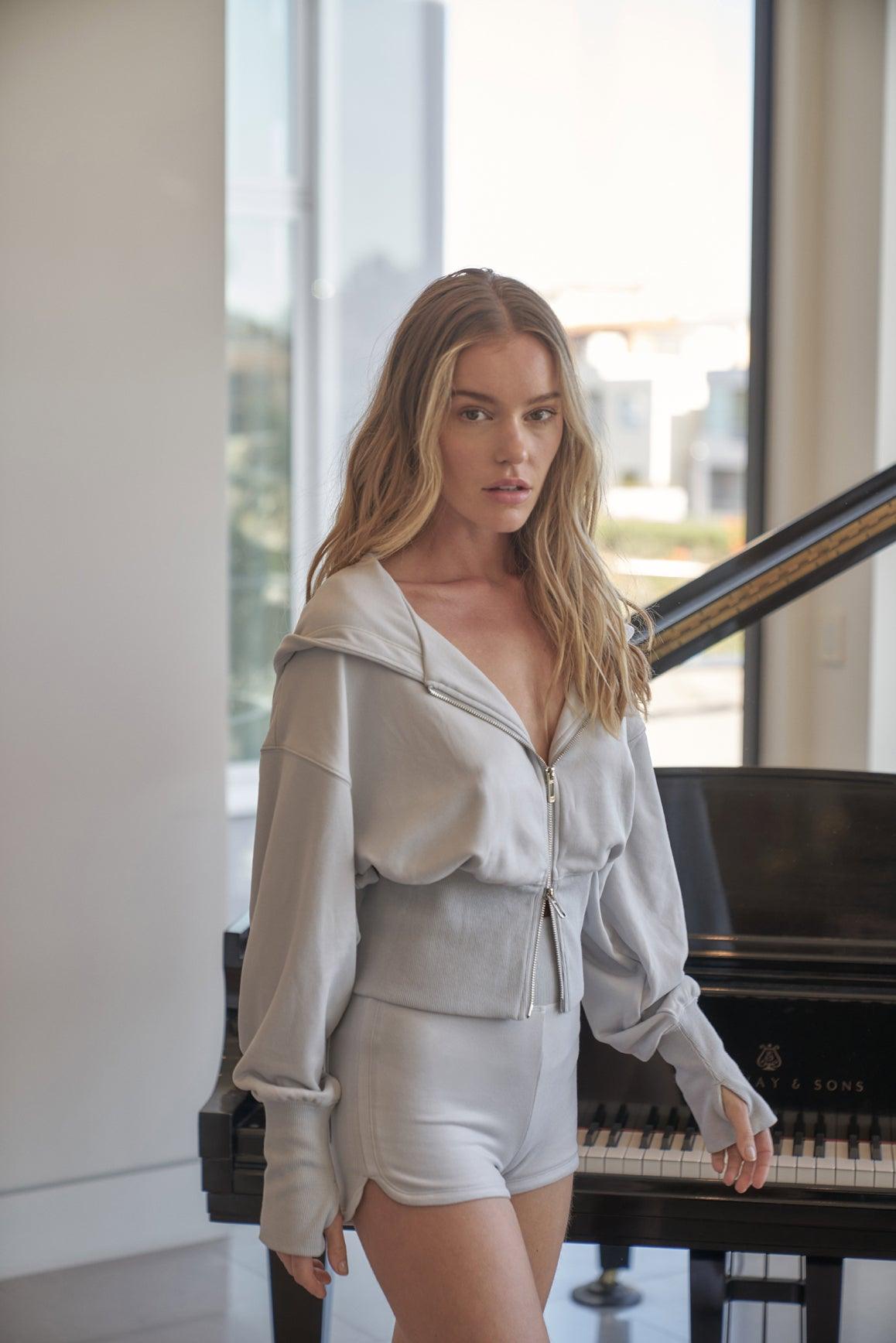 Cream WISKII Leisure Mini Shorts, lightweight casual shorts with a relaxed fit, shown on a model.