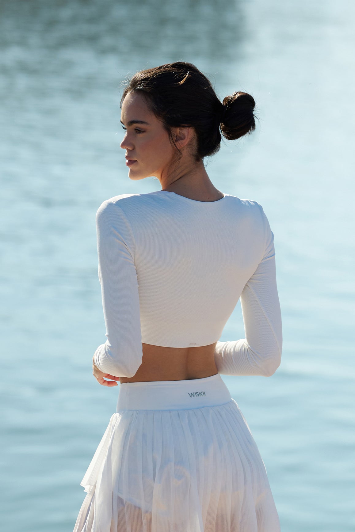 Model wears WISKII Elegant Long Sleeve Crop Top |  Ivory