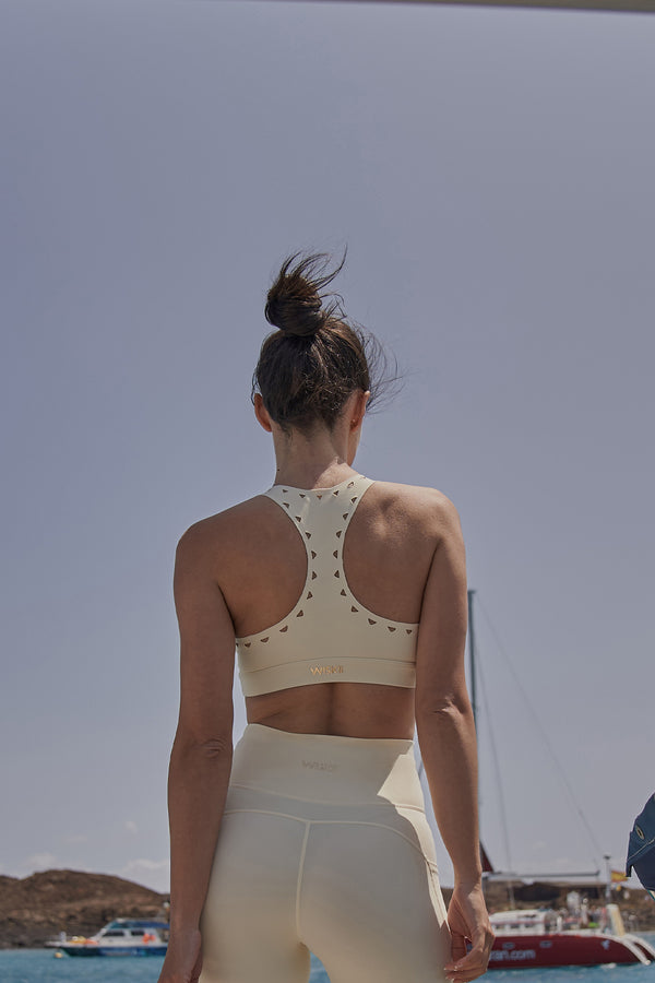 Model wears WISKII Racerback Laser Cut Sports Bra