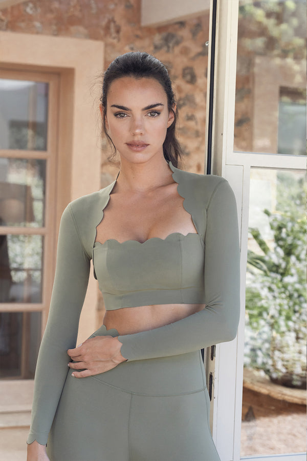 Model wears WISKII Scallop Cropped Long Sleeve Top in color Sage | New color in 2024