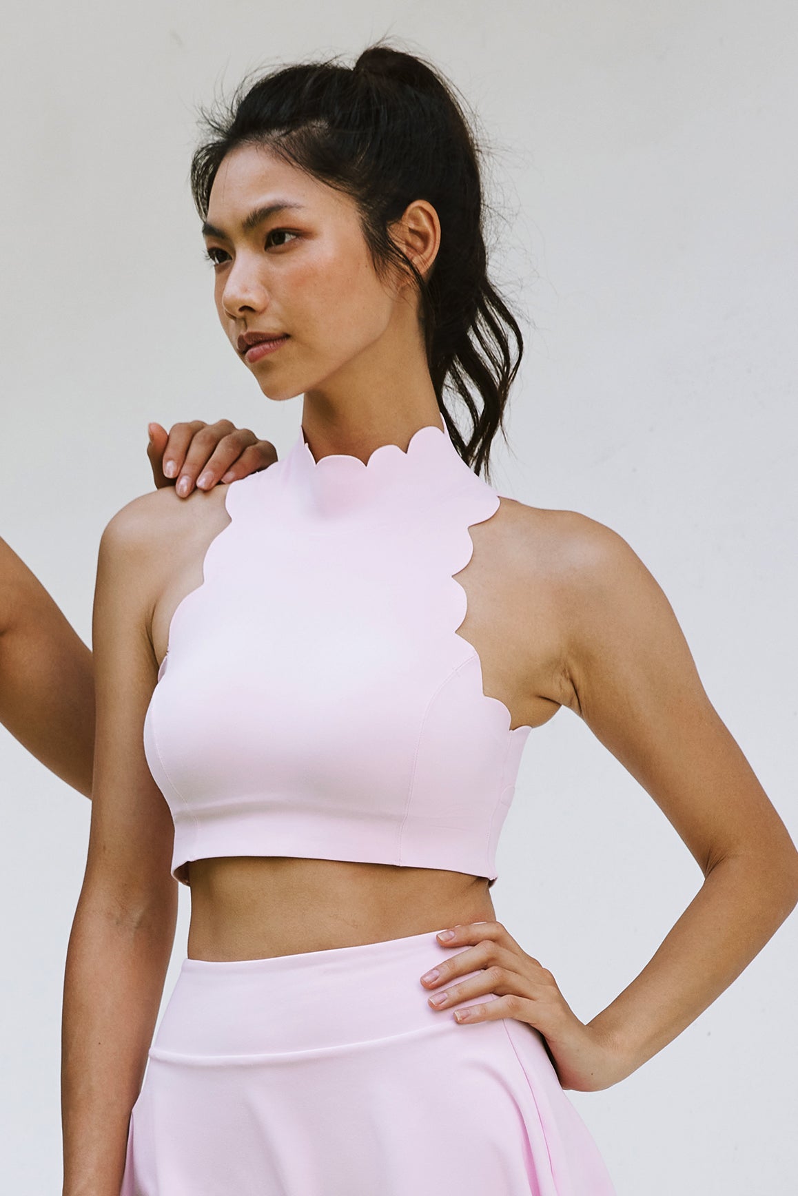 Model wears Scallop Back Mock Neck Bra | WISKII ACTIVE