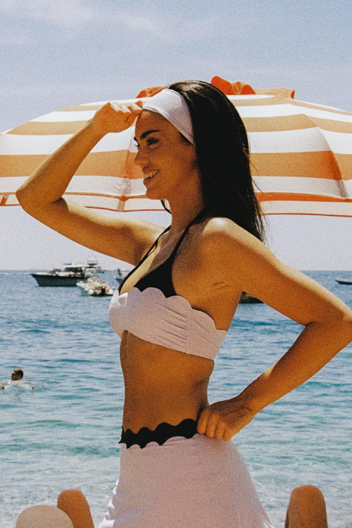 WISKII scallop contour halter sports bra with supportive design and stylish scalloped edges, suitable for active wear.