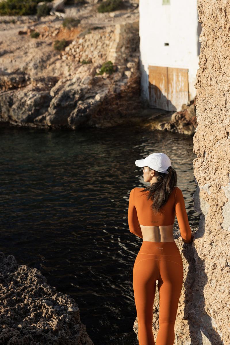 Model wears Twist-Front Long Sleeve Crop Top | WISKII ACTIVE