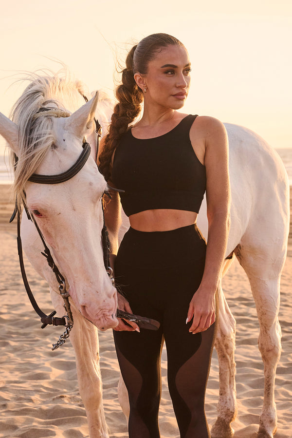 Model wears Move Freely Back Cutout Bra | WISKII ACTIVE