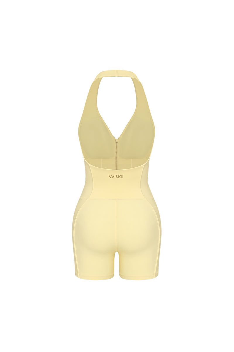 Model wears a Riviera Hourglass Zip Front Romper | Lemon Drop | WSKII Active