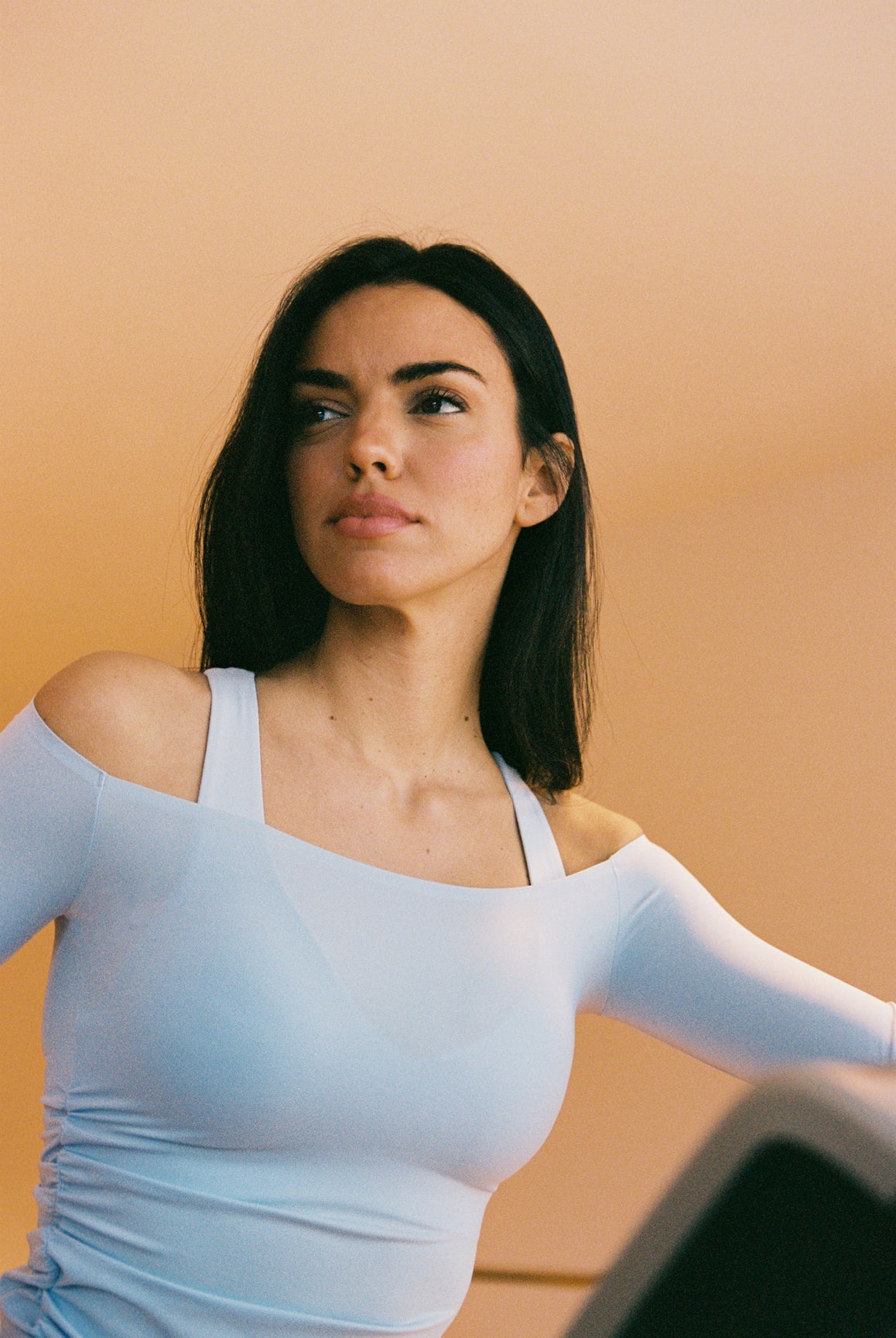 Model wears a Long Sleeve Ruched Off-Shoulder Top | WISKII ACTIVE | Color Heavenly Blue