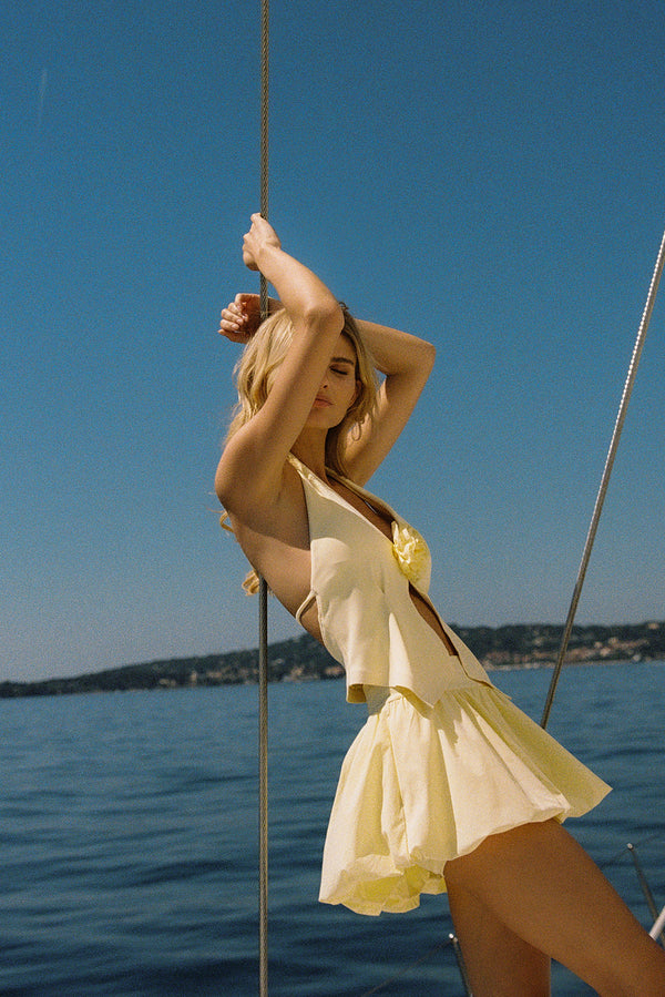 Model wears a Mini Bubble Skirt | Lemon Drop | WISKII Active