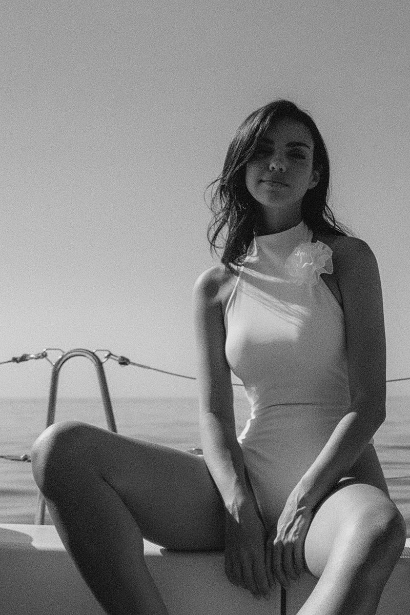 Model wears a Riviera Floral Backless One-piece Swimsuit | Ivory Swimsuit | WISKII Active