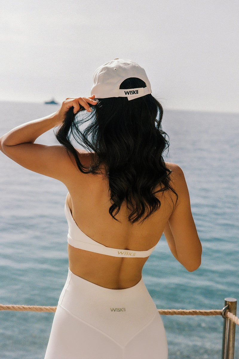 Model wears a Riviera Floral Crisscross Bra | Ivory | WISKII Active