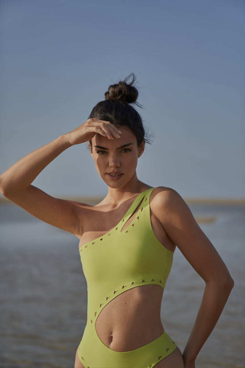 Model wears WISKII One Shoulder Laser Cut Swimsuit