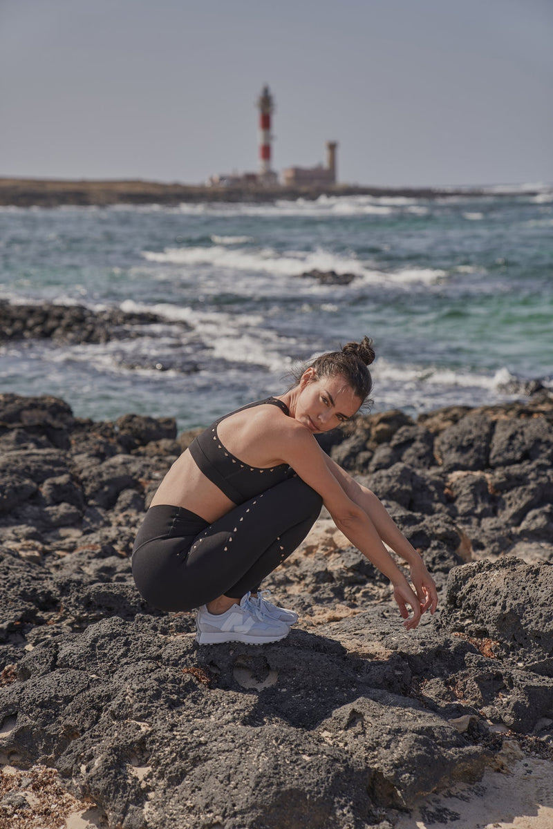 Model wears Racerback Laser Cut Sports Bra + V-waist Laser Cut Sports Legging | WISKII 