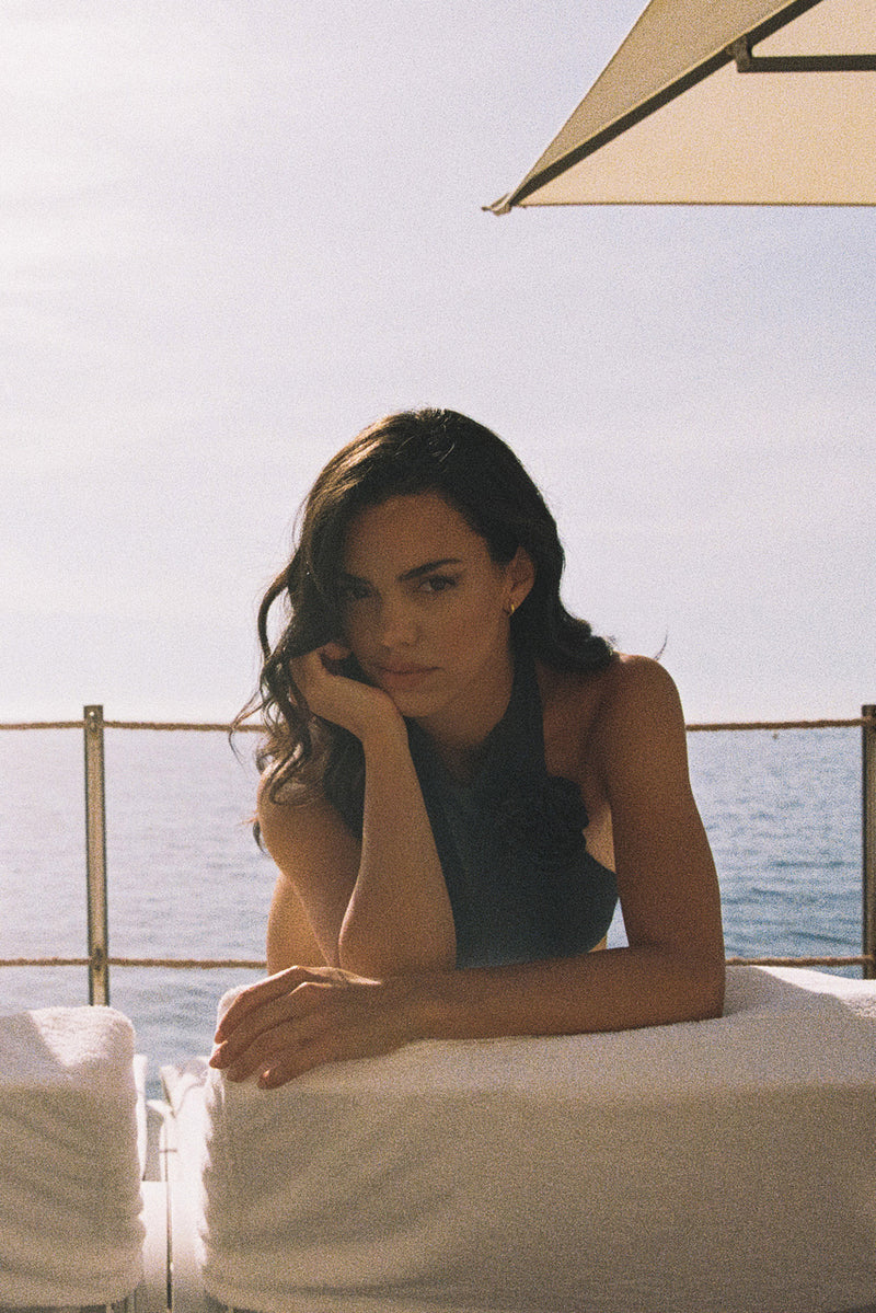 Model wears a Riviera Floral Backless One-piece Swimsuit | Deep sea Swimsuit | WISKII Active