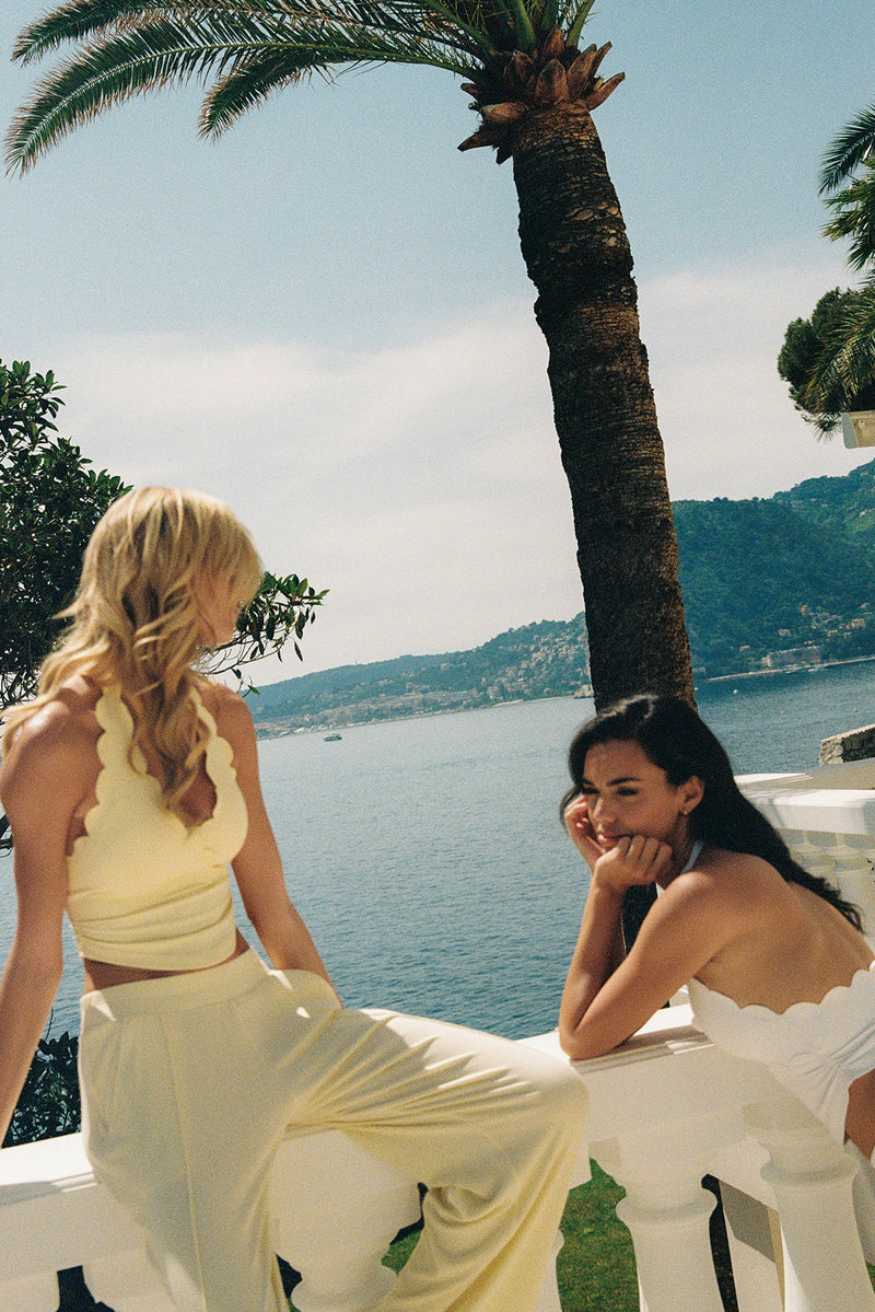 Models wear Riviera Scallop Halter Bra Tank | WISKII Active